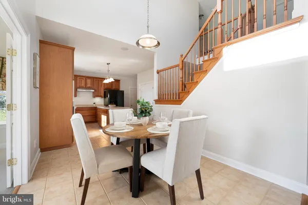 a kitchen with stainless steel appliances granite countertop a sink and a white cabinets