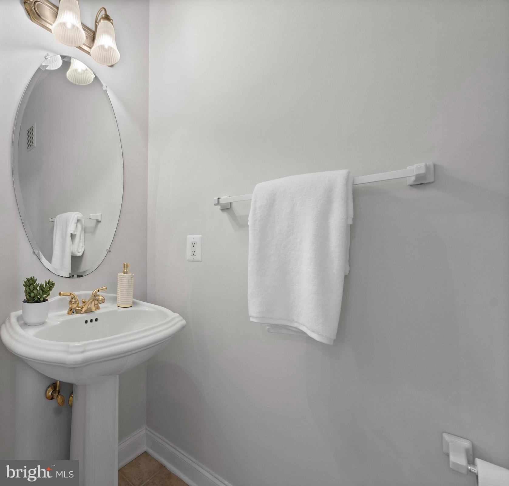 3300 Lancer Court Dunkirk, MD 20754 - Photo 39 of 89 a bathroom with a sink and mirror