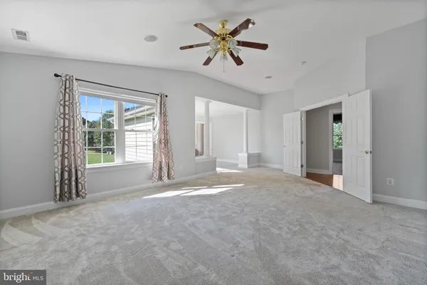 an aerial view of a house with yard swimming pool and outdoor seating