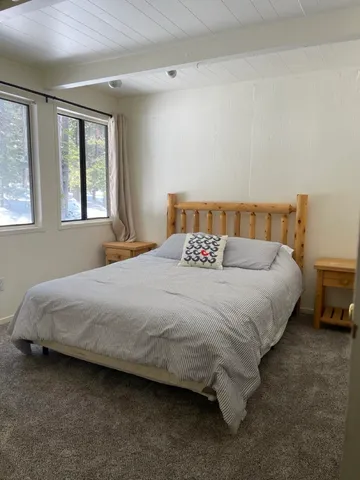 a bathroom with a double vanity sink and mirror