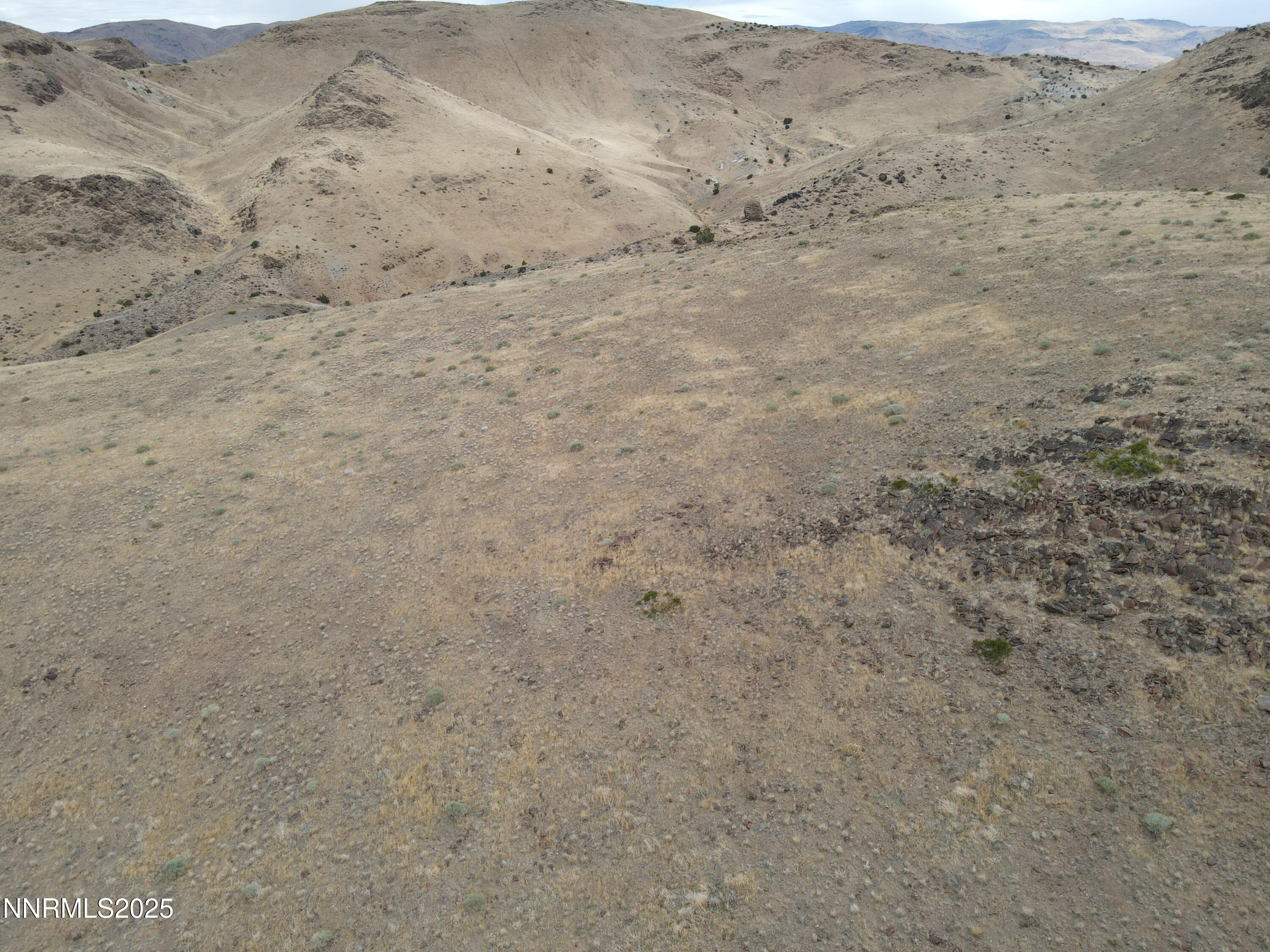 0 Pyramid (076-261-04) Way Reno, NV 89510 - Photo 19 of 43 a view of a dry yard with mountains in the background