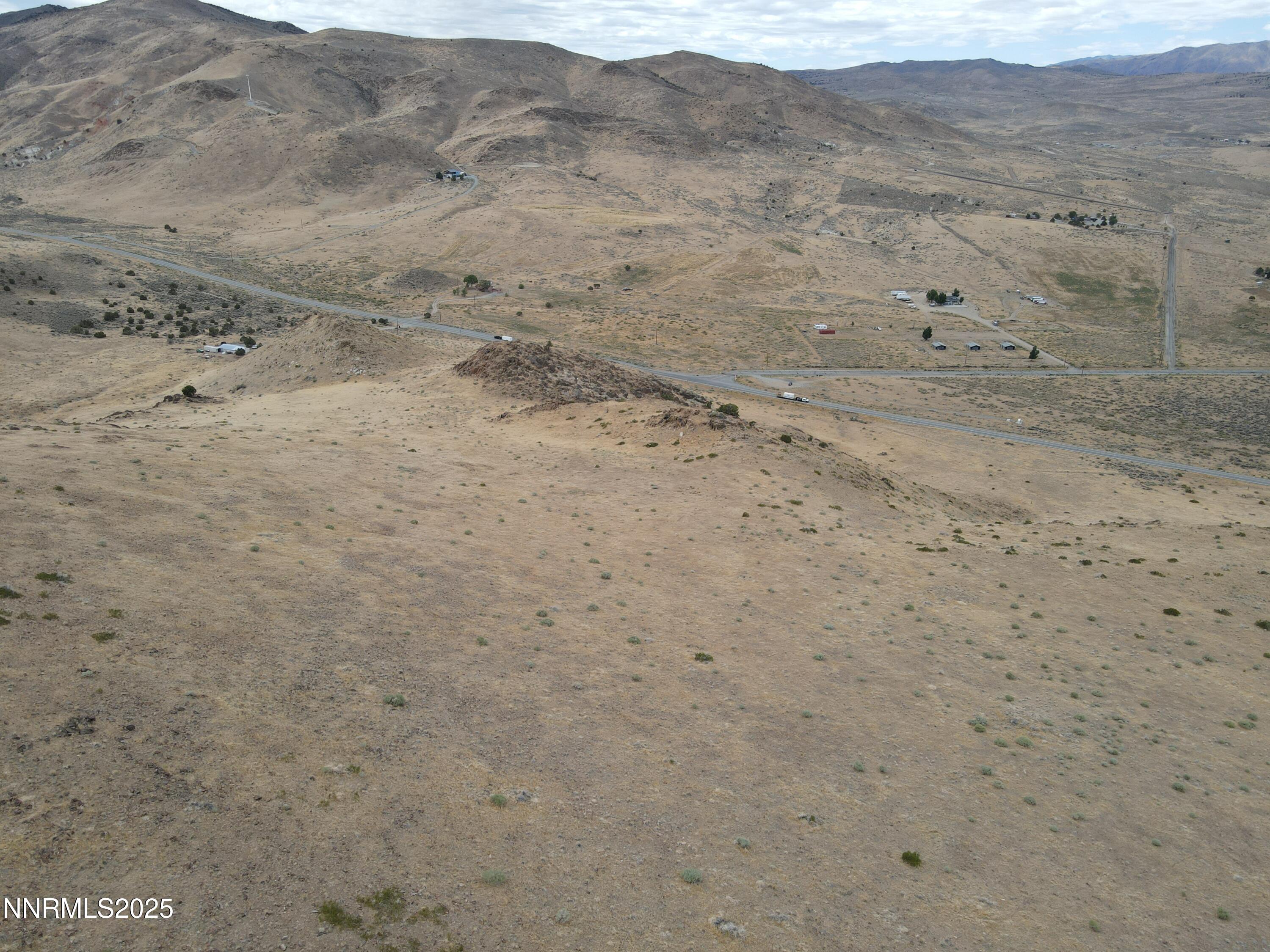 0 Pyramid (076-261-04) Way Reno, NV 89510 - Photo 23 of 43 a view of a dry field with wooden fence