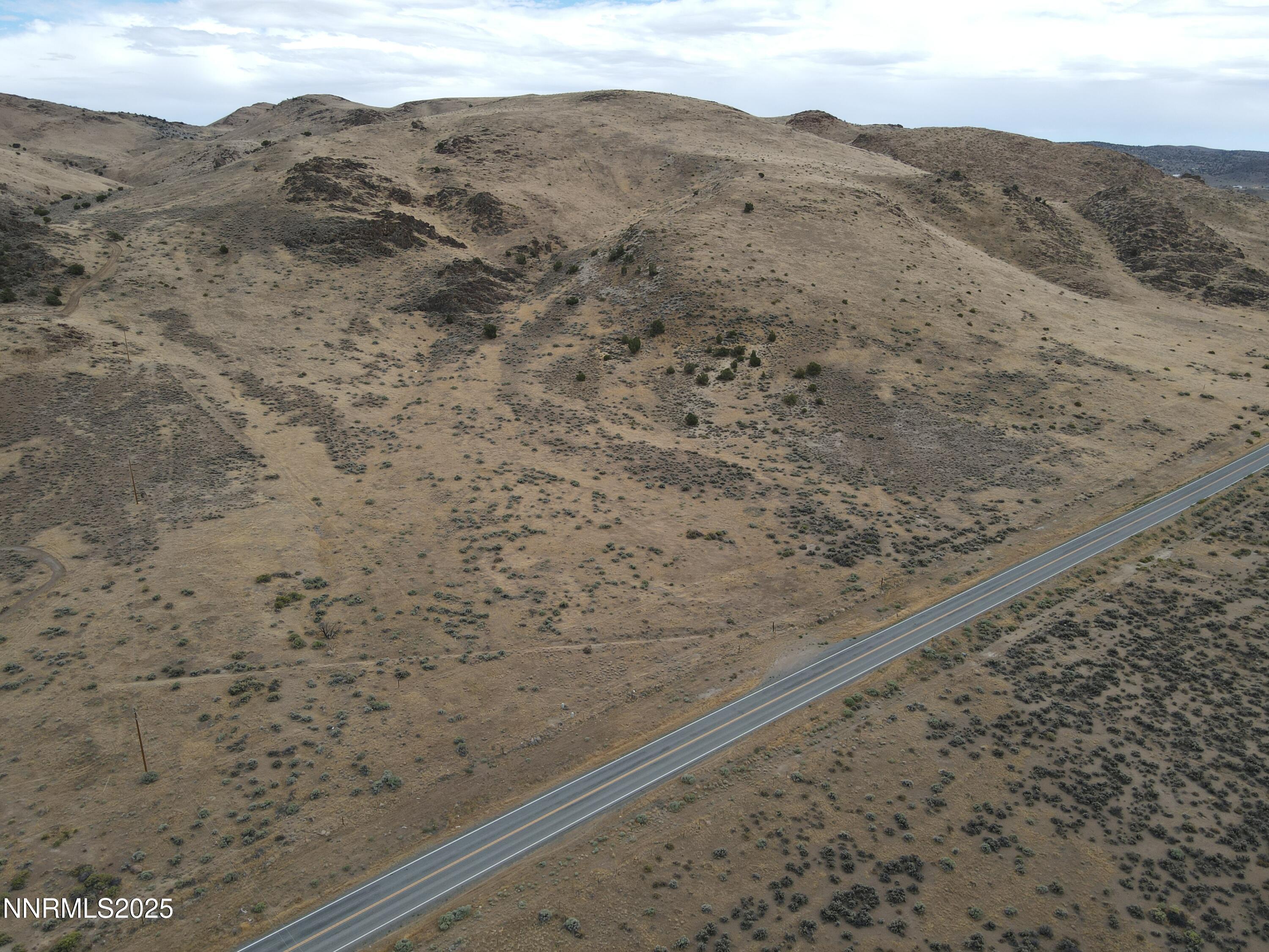 0 Pyramid (076-261-04) Way Reno, NV 89510 - Photo 4 of 43 a view of a dry yard with mountains in the background
