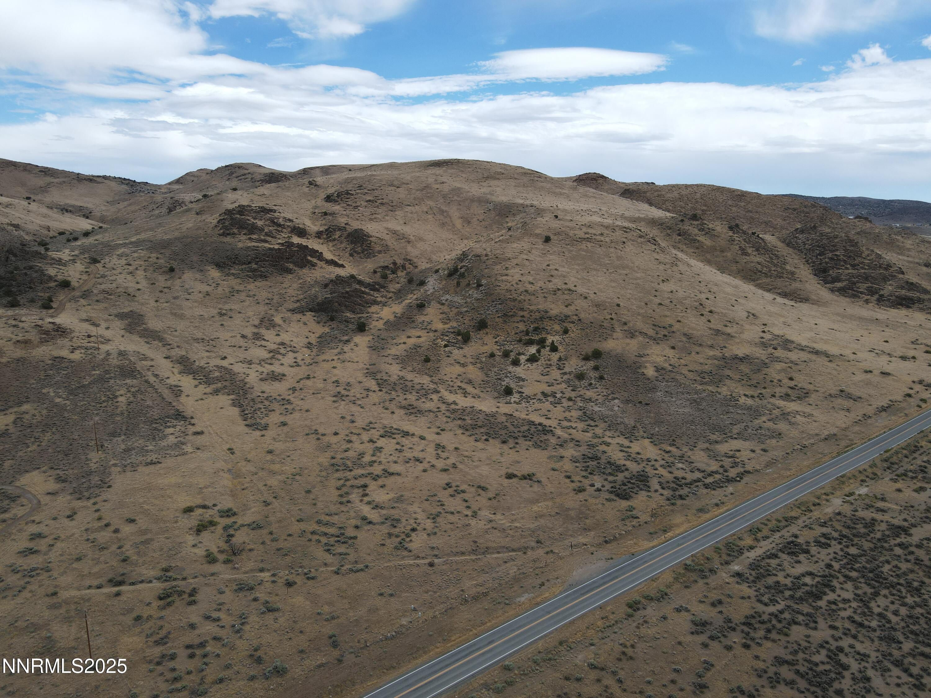 0 Pyramid (076-261-04) Way Reno, NV 89510 - Photo 5 of 43 a view of a dry yard with mountains in the background