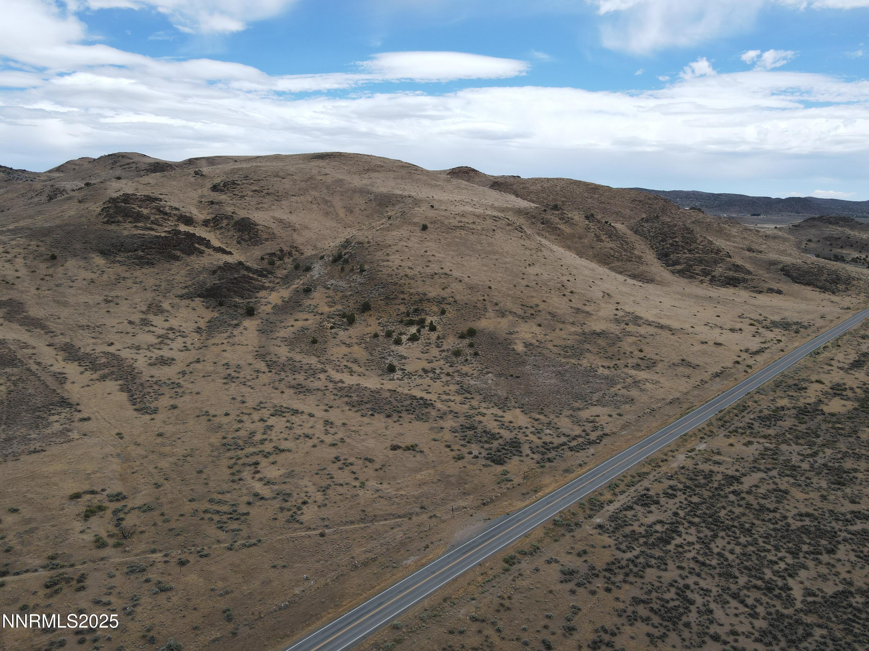 0 Pyramid (076-261-04) Way Reno, NV 89510 - Photo 6 of 43 a view of a dry yard with mountains in the background
