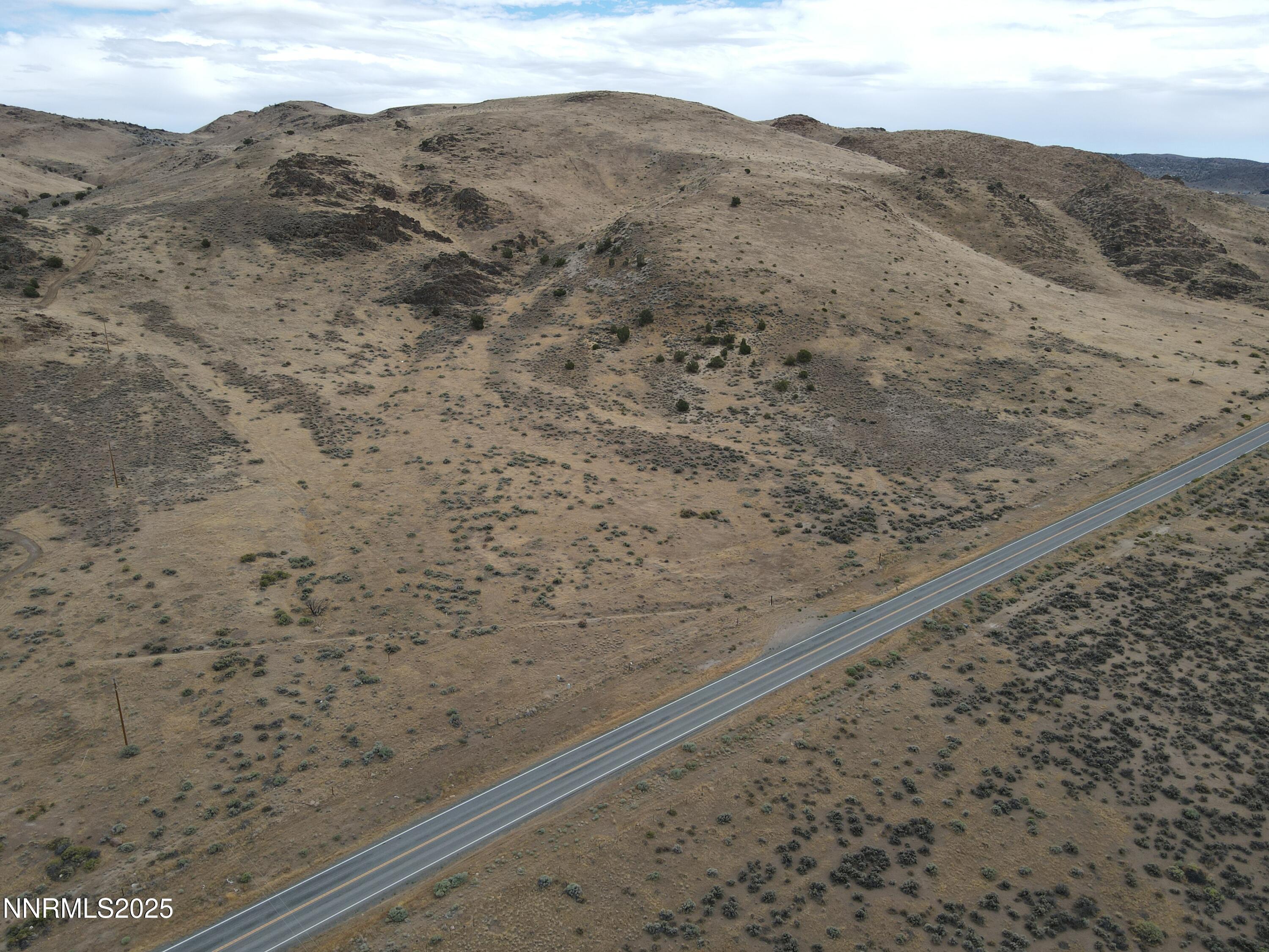 0 Pyramid (076-261-04) Way Reno, NV 89510 - Photo 7 of 43 a view of a dry yard with mountains in the background