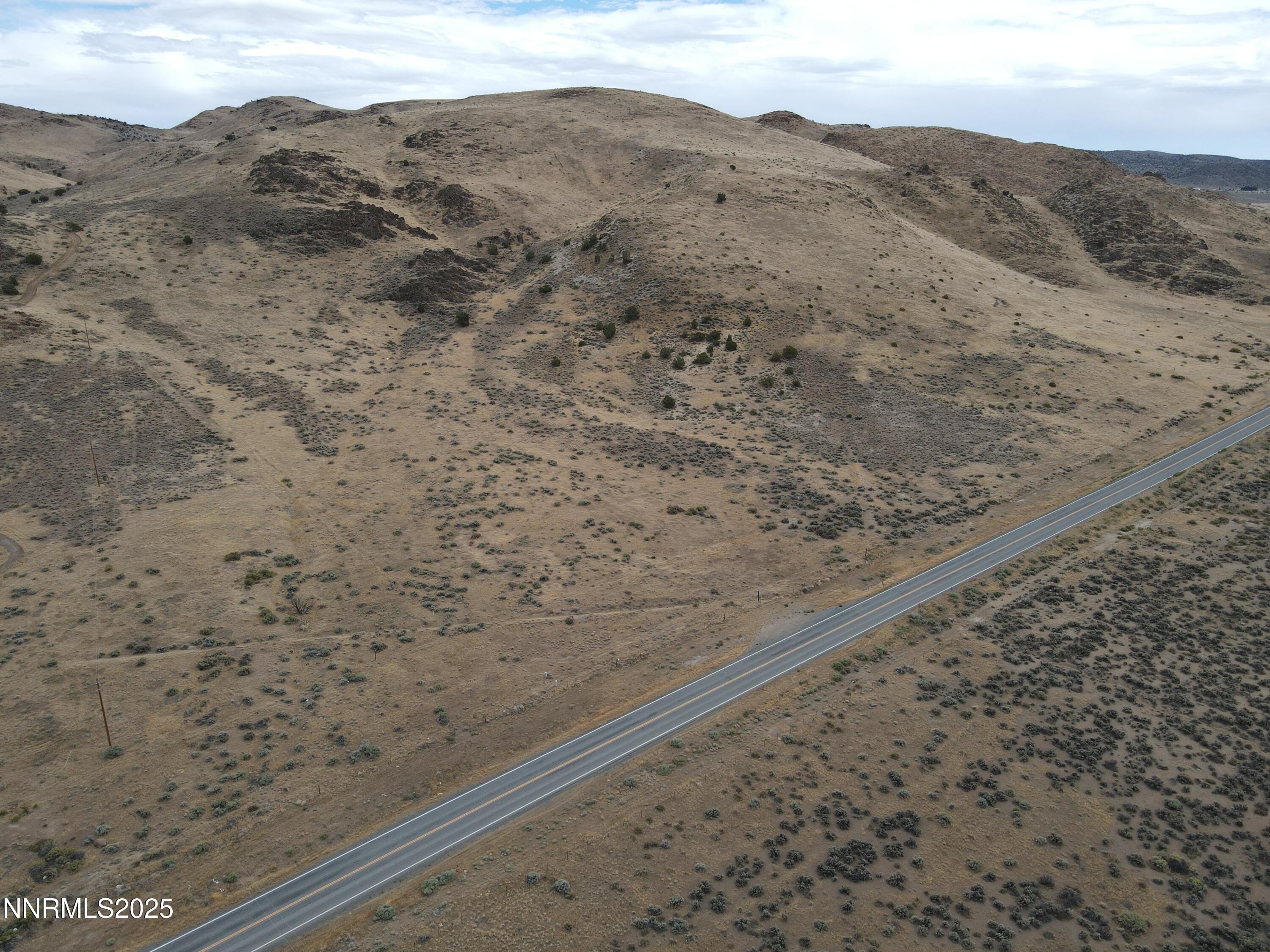 0 Pyramid (076-261-04) Way Reno, NV 89510 - Photo 8 of 43 a view of a dry yard with mountains in the background