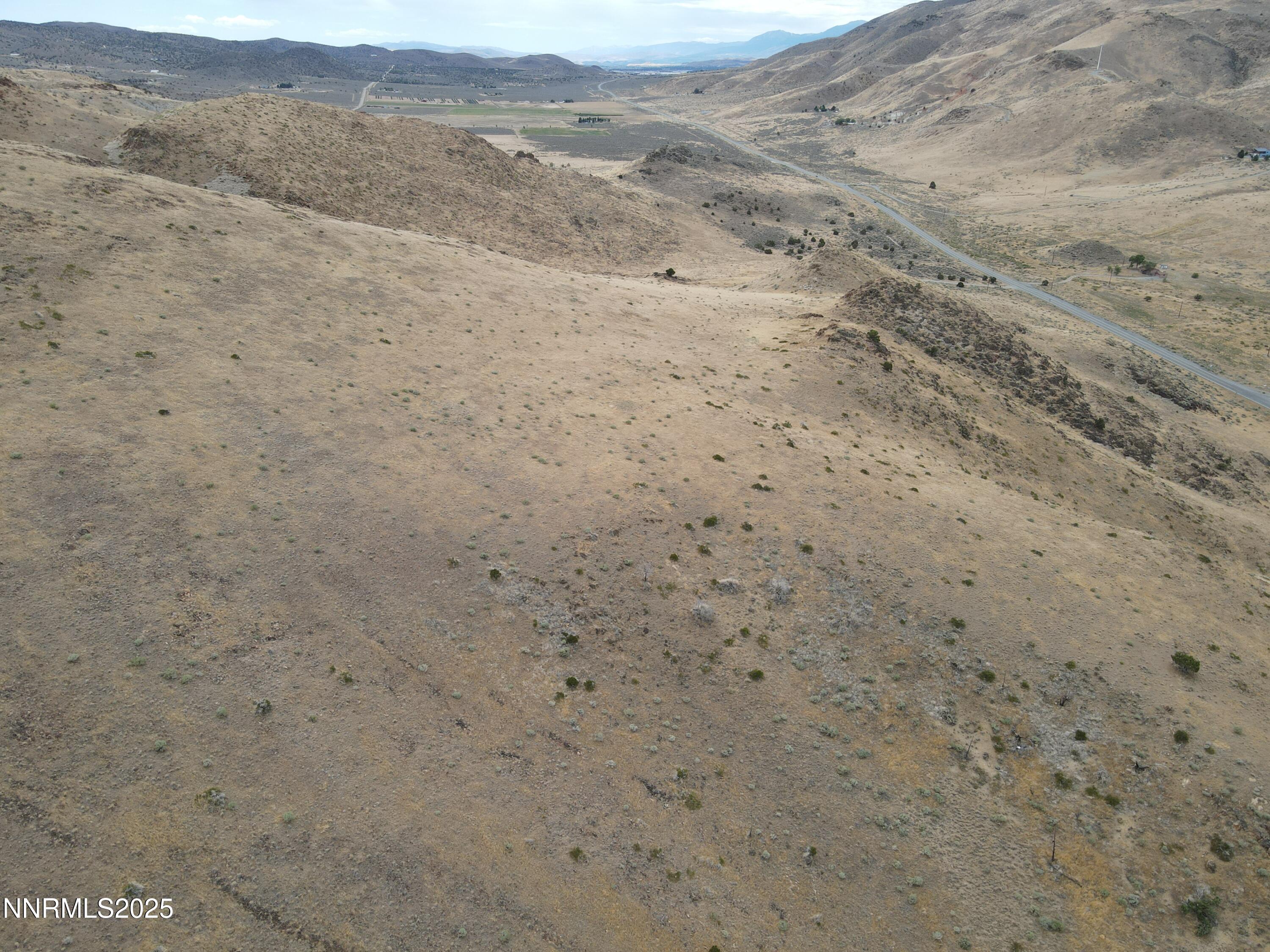0 Pyramid (076-261-04) Way Reno, NV 89510 - Photo 9 of 43 a view of a dry field with mountains in the background