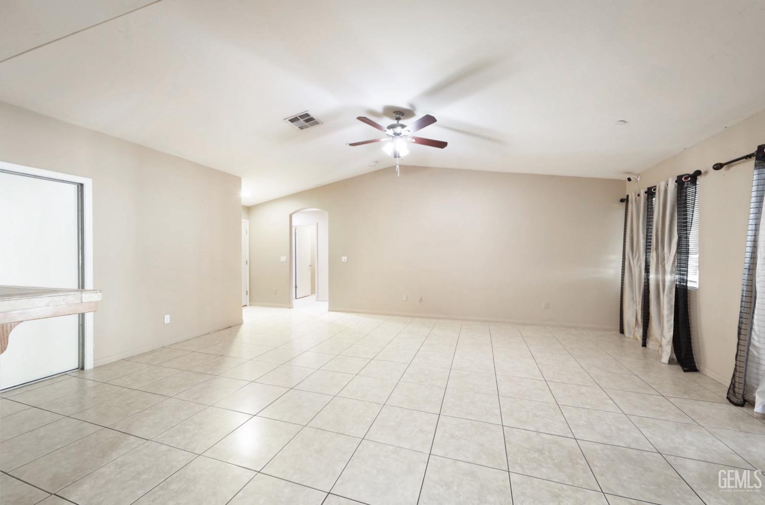 Undisclosed Address Bakersfield, CA 93306 - Photo 11 of 21 a view of an empty room with a window