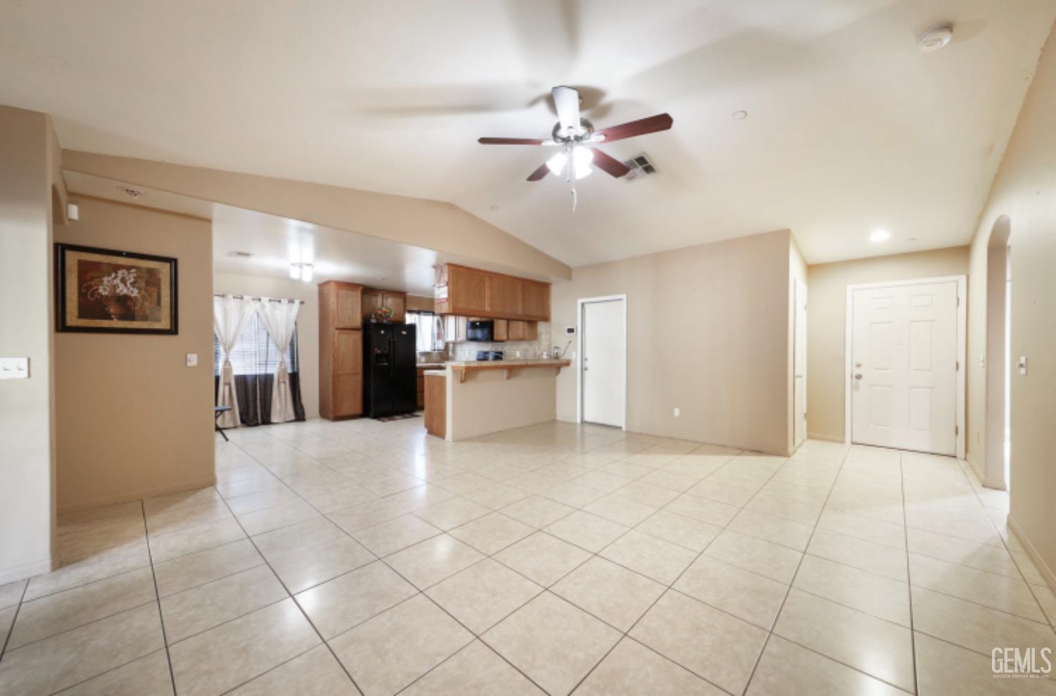Undisclosed Address Bakersfield, CA 93306 - Photo 13 of 21 a view of a kitchen with a sink and a refrigerator