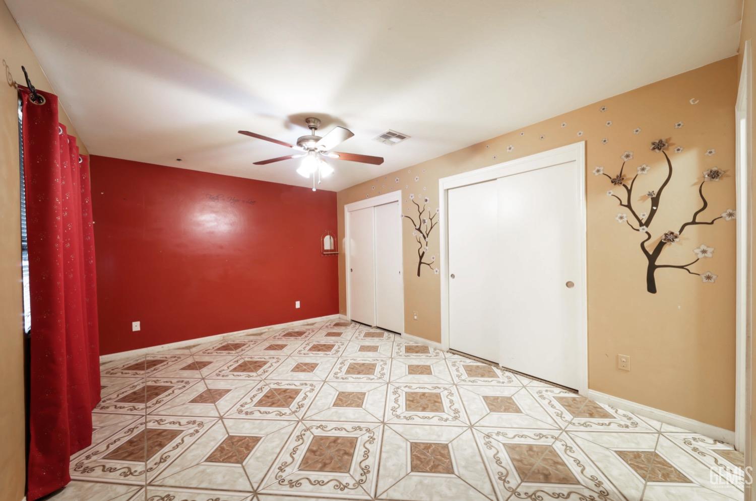 Undisclosed Address Bakersfield, CA 93306 - Photo 17 of 21 a view of a livingroom with a chandelier fan and a bedroom