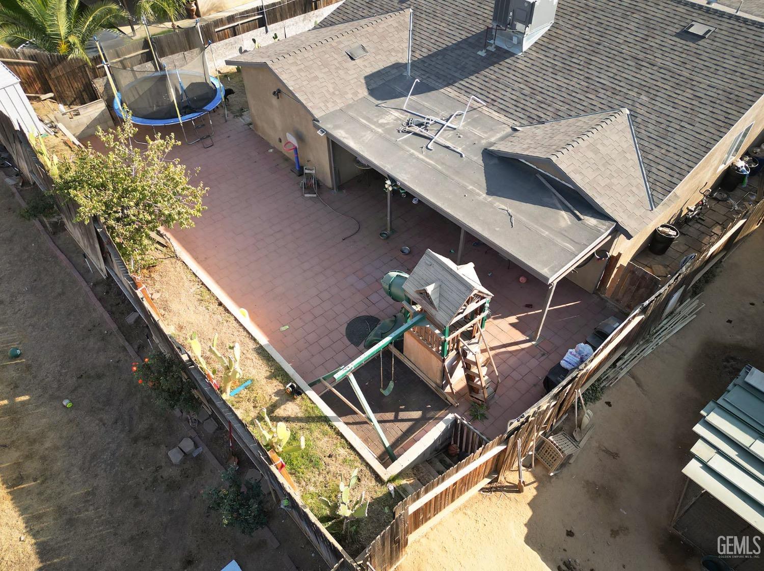 Undisclosed Address Bakersfield, CA 93306 - Photo 19 of 21 an aerial view of a house with a yard