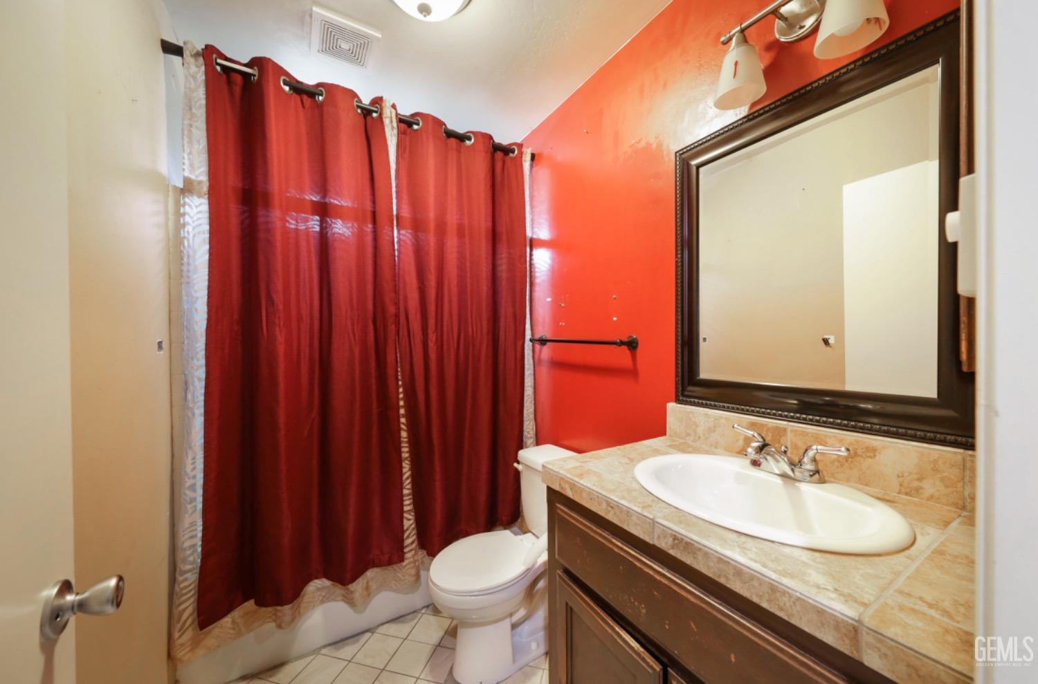 Undisclosed Address Bakersfield, CA 93306 - Photo 7 of 21 a bathroom with a sink and a mirror