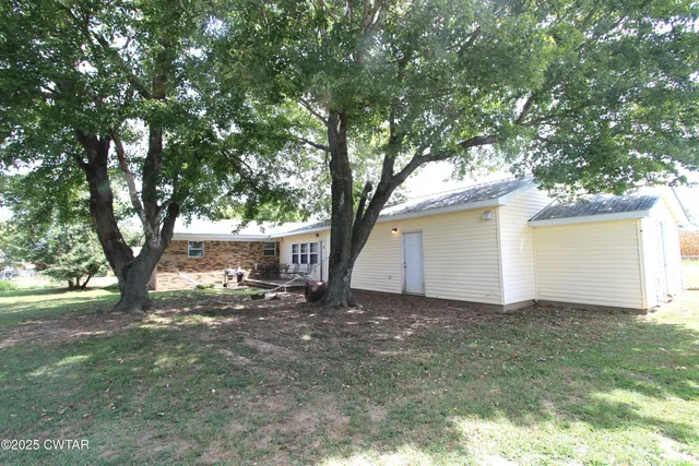 a view of a house with a tree and a tree