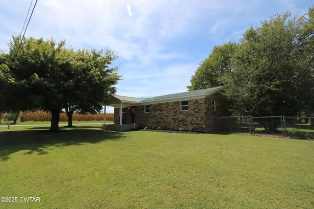 a view of a patio with a yard