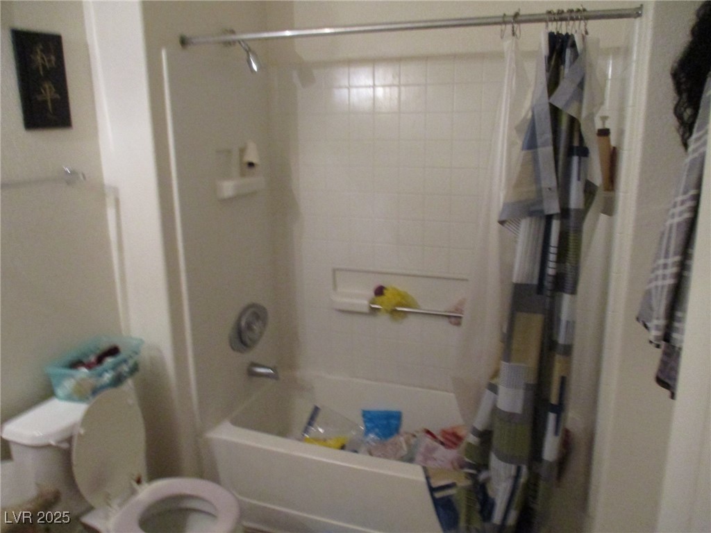 3318 North Decatur Boulevard, Unit 1044 Las Vegas, NV 89130 - Photo 14 of 18 Bathroom featuring toilet and shower / tub combo w
