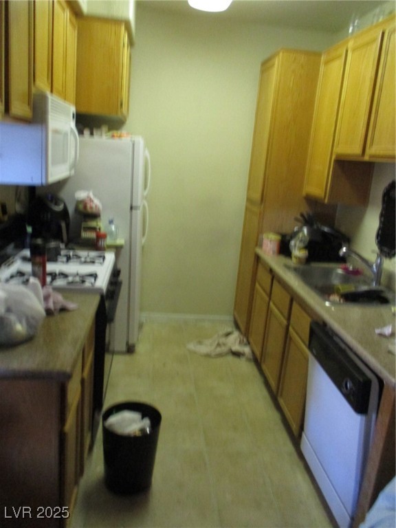 3318 North Decatur Boulevard, Unit 1044 Las Vegas, NV 89130 - Photo 5 of 18 Kitchen featuring baseboards, light countertops, d