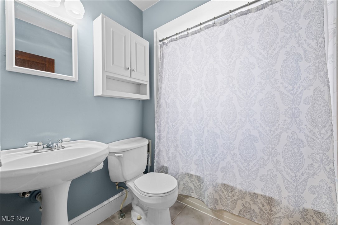 3918 Bluestone Road Cleveland Heights, OH 44121 - Photo 17 of 27 Bathroom featuring toilet, a shower with shower curtain, and tile floors