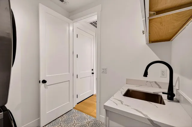 a front view of a house with yard and green space