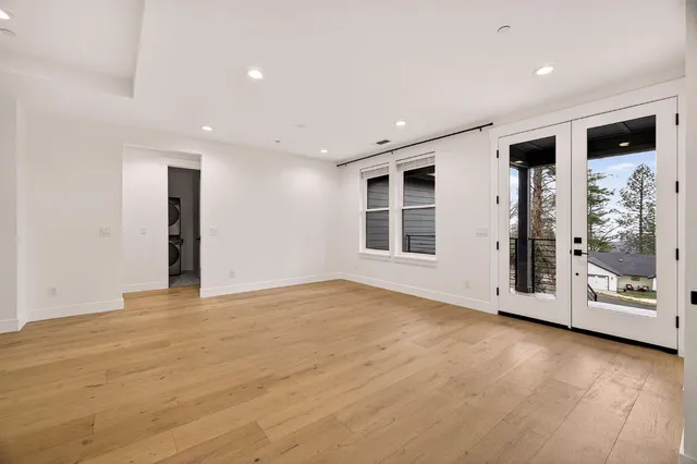 a kitchen with stainless steel appliances kitchen island granite countertop a refrigerator and a stove top oven