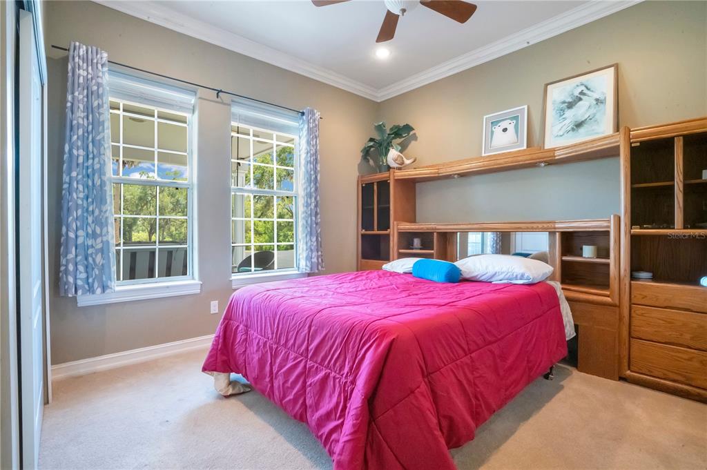 5785 Gilliam Road Orlando, FL 32818 - Photo 44 of 100 a bedroom with a bed and a window