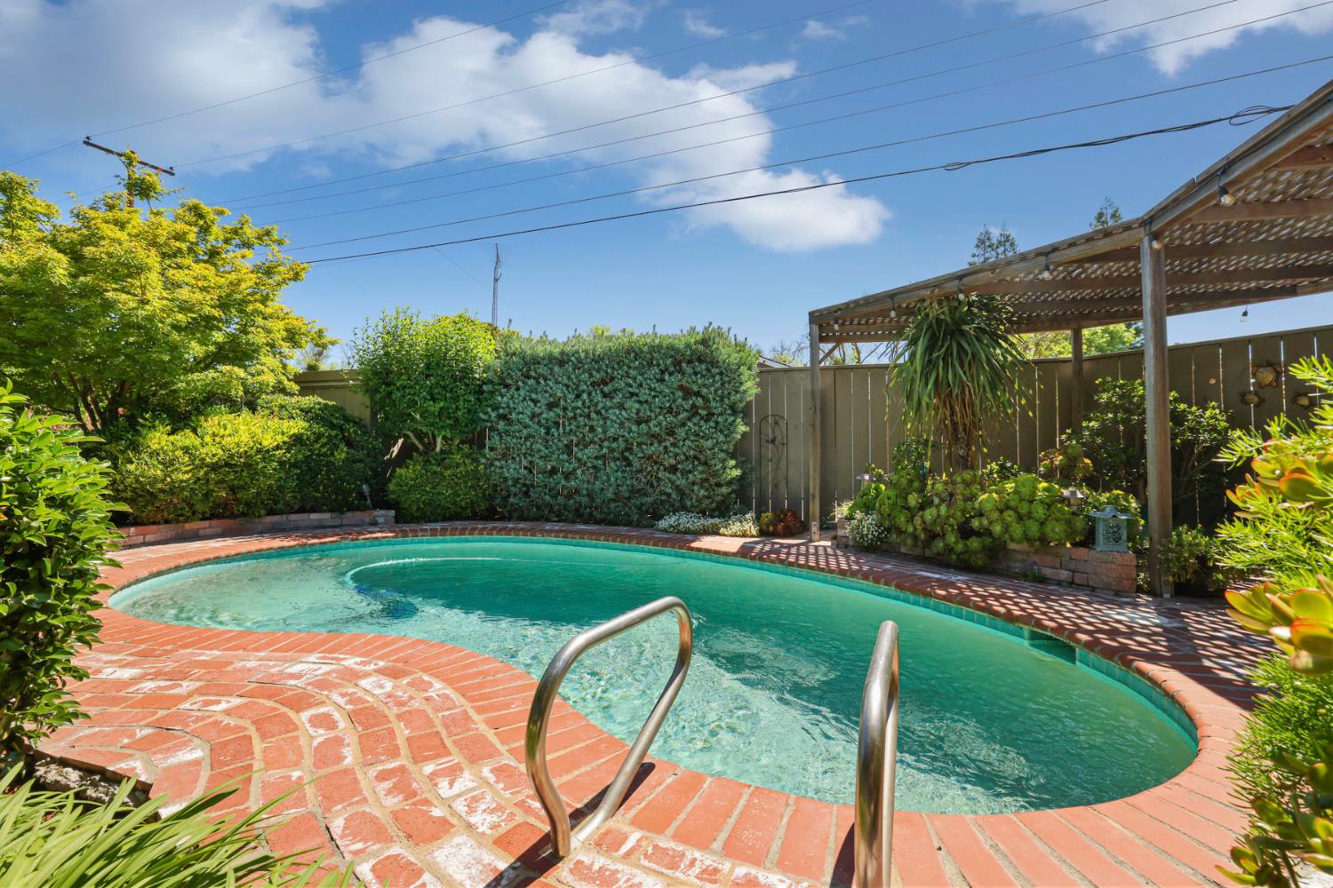 2406 Kenmore Court Modesto, CA 95350 - Photo 40 of 54 a view of a backyard with plants and a patio