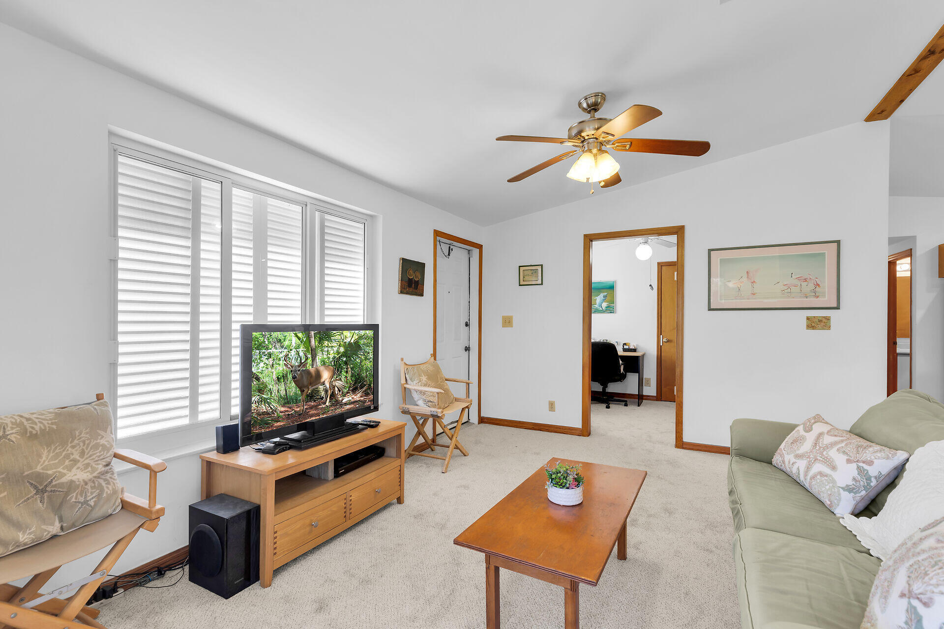 30625 16th Lane Big Pine Key, FL 33043 - Photo 11 of 42 a living room with furniture and a flat screen tv
