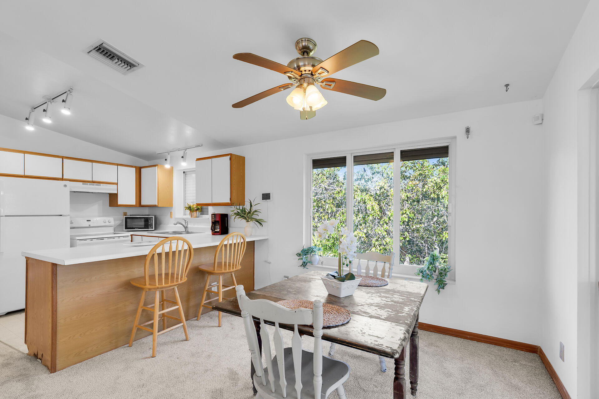 30625 16th Lane Big Pine Key, FL 33043 - Photo 17 of 42 a view of a dining room with furniture window and wooden floor