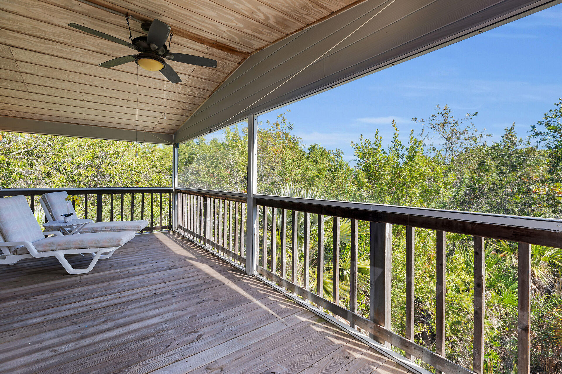 30625 16th Lane Big Pine Key, FL 33043 - Photo 3 of 42 a balcony with wooden floor and outdoor space