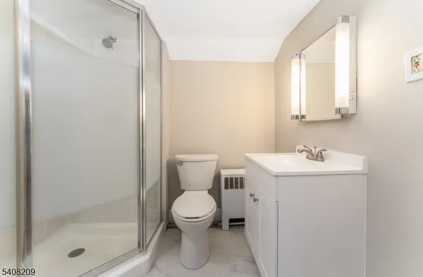 a bathroom with a toilet sink and a shower