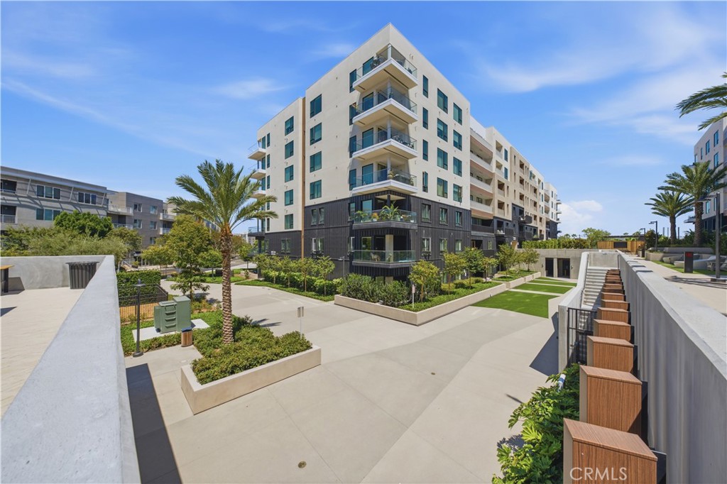 3101 Rivington Irvine, CA 92612 - Photo 25 of 42 a view of a tall building next to a yard