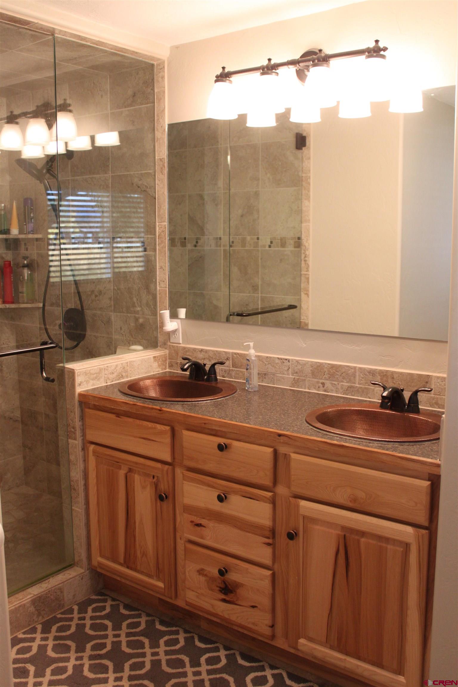 20976 6840th Road Montrose, CO 81403 - Photo 14 of 33 a bathroom with a sink and a mirror