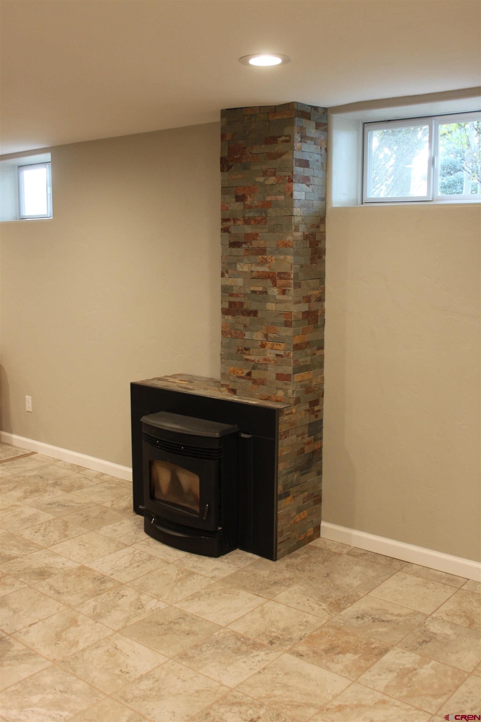 20976 6840th Road Montrose, CO 81403 - Photo 17 of 33 a room with a fireplace