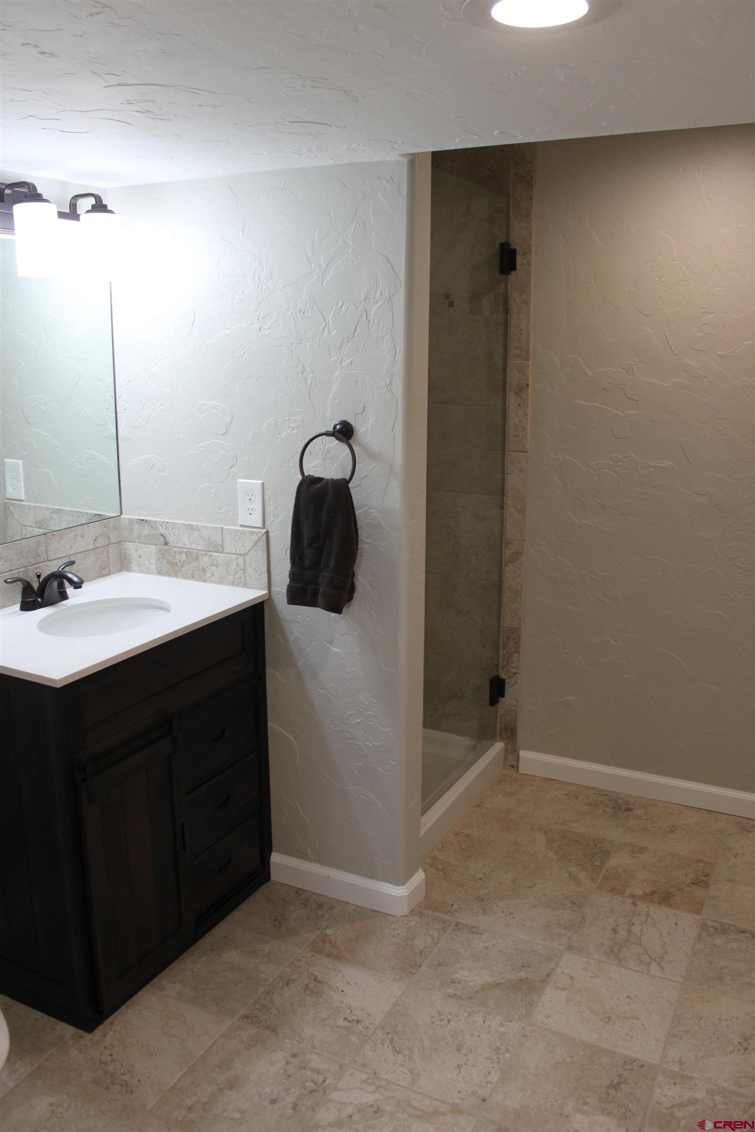 20976 6840th Road Montrose, CO 81403 - Photo 19 of 33 a bathroom with a sink and a mirror