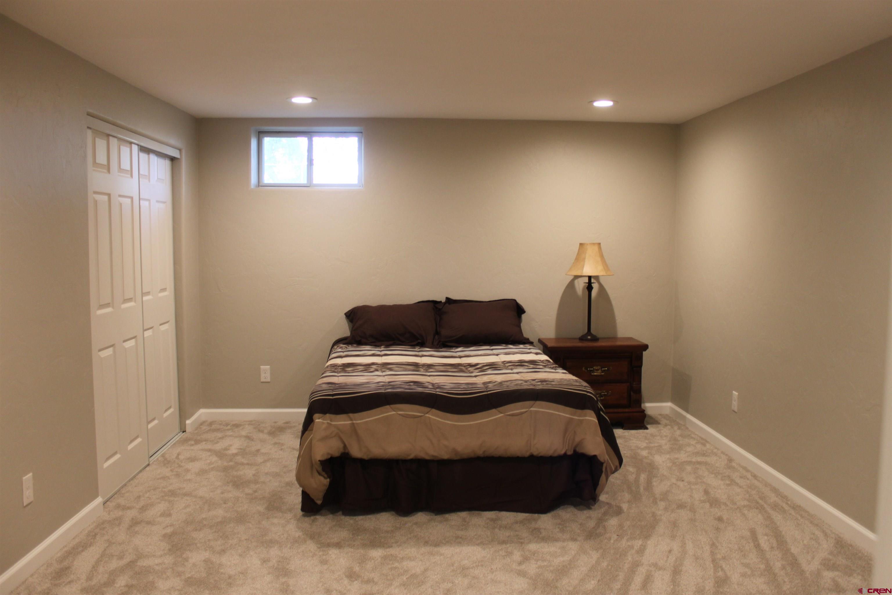20976 6840th Road Montrose, CO 81403 - Photo 20 of 33 a bedroom with a bed and a window