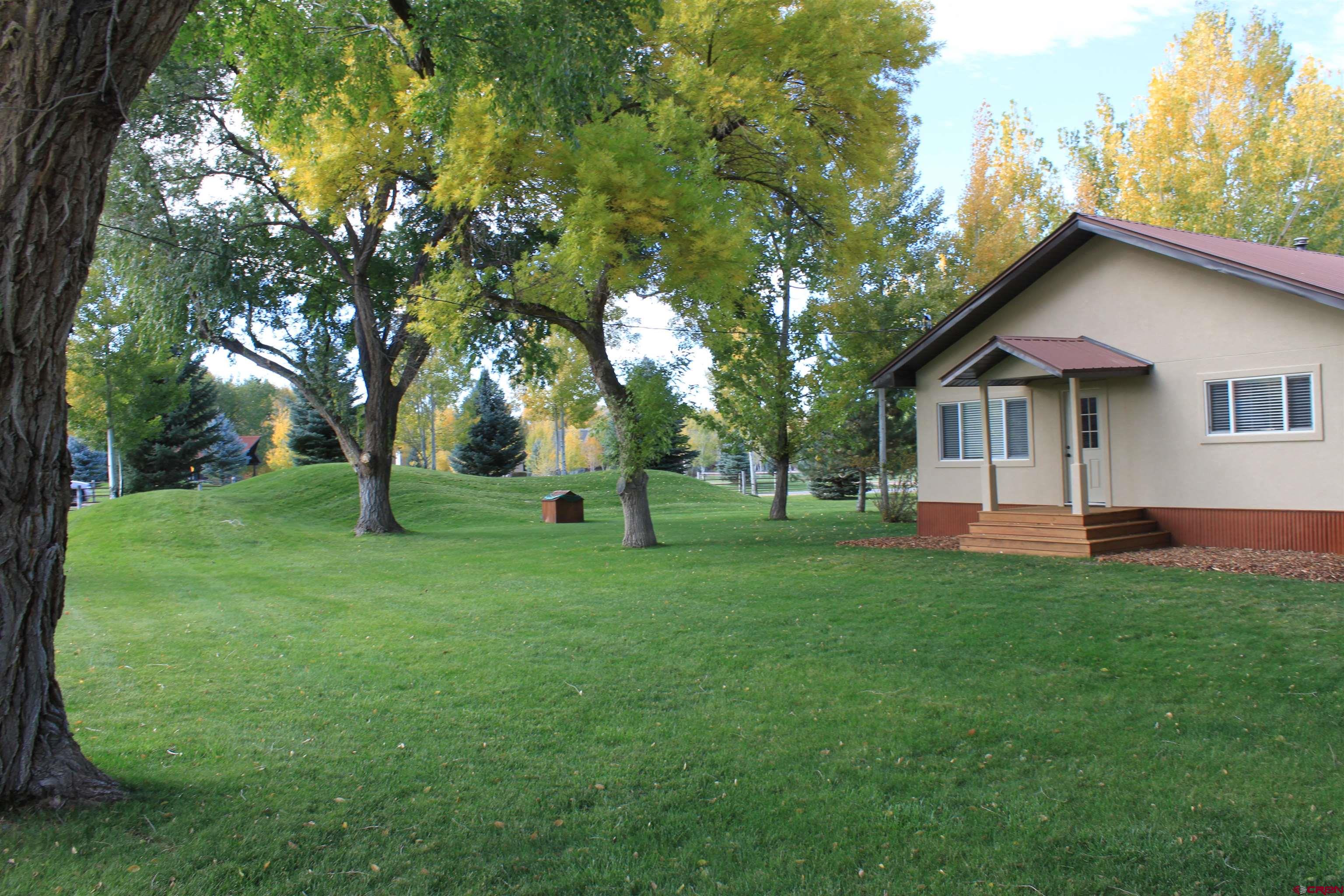 20976 6840th Road Montrose, CO 81403 - Photo 3 of 33 a view of a house with a backyard