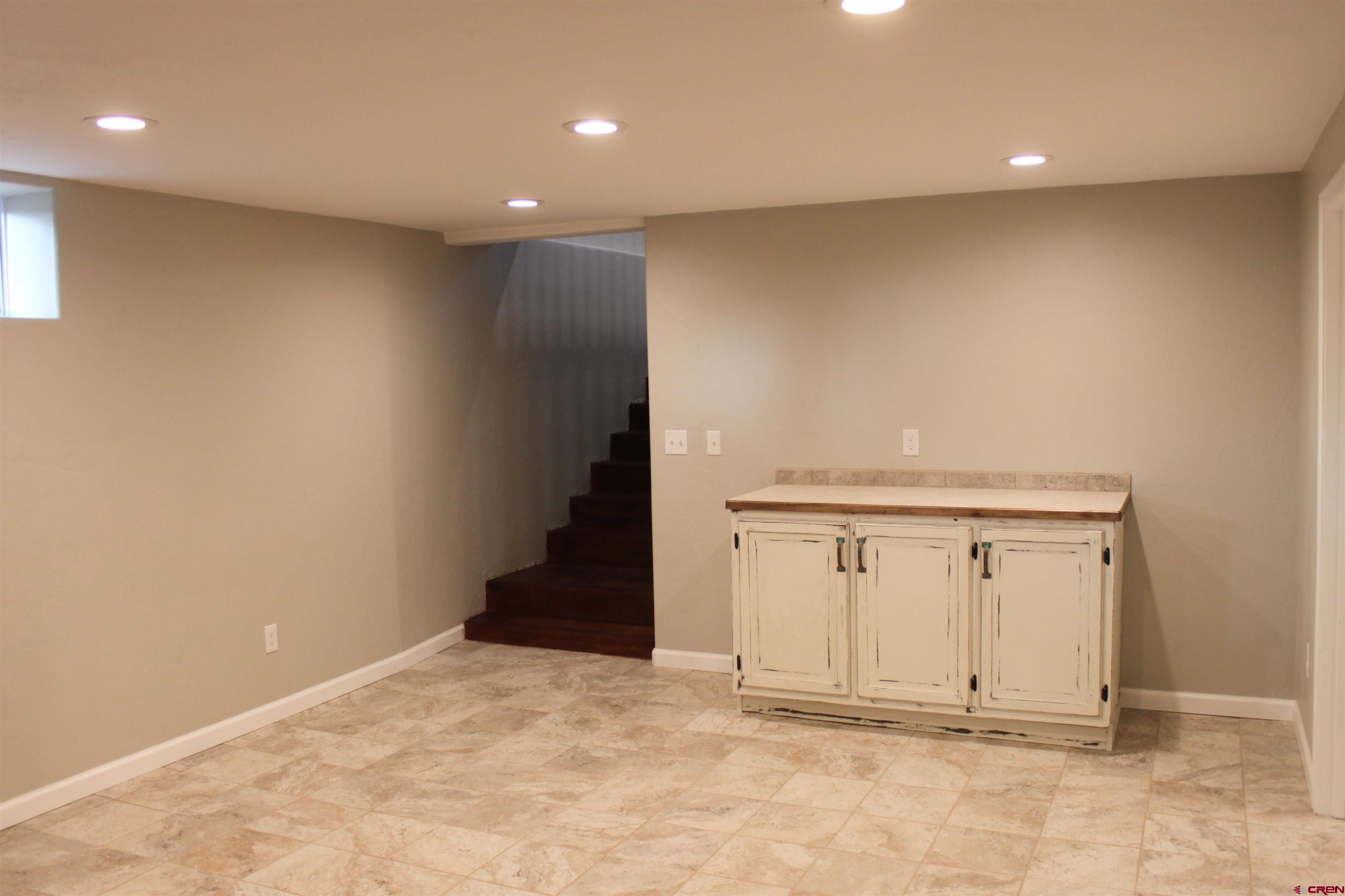 20976 6840th Road Montrose, CO 81403 - Photo 21 of 33 an empty room with wooden floor and white doors