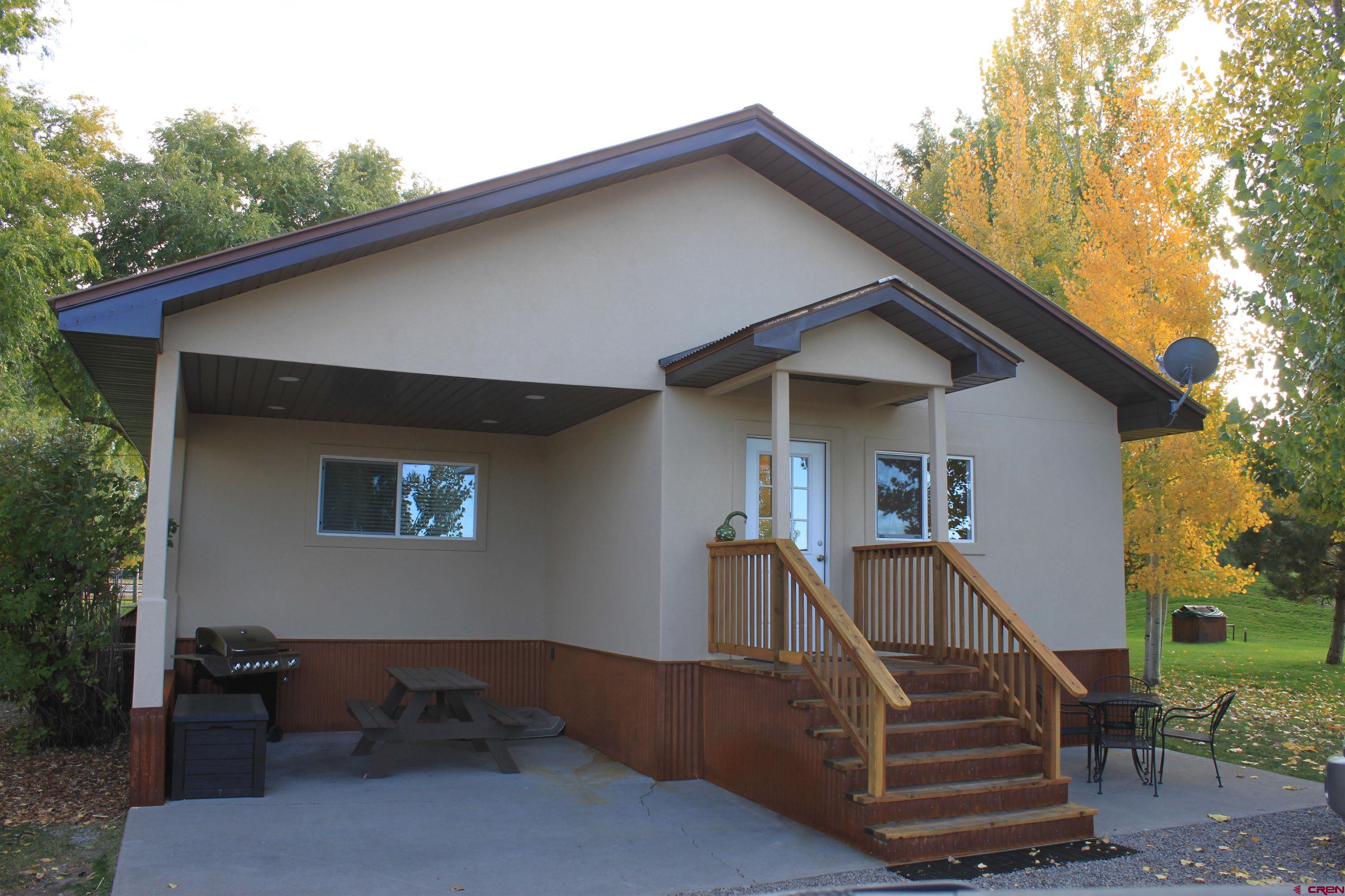 20976 6840th Road Montrose, CO 81403 - Photo 22 of 33 a front view of a house with a yard
