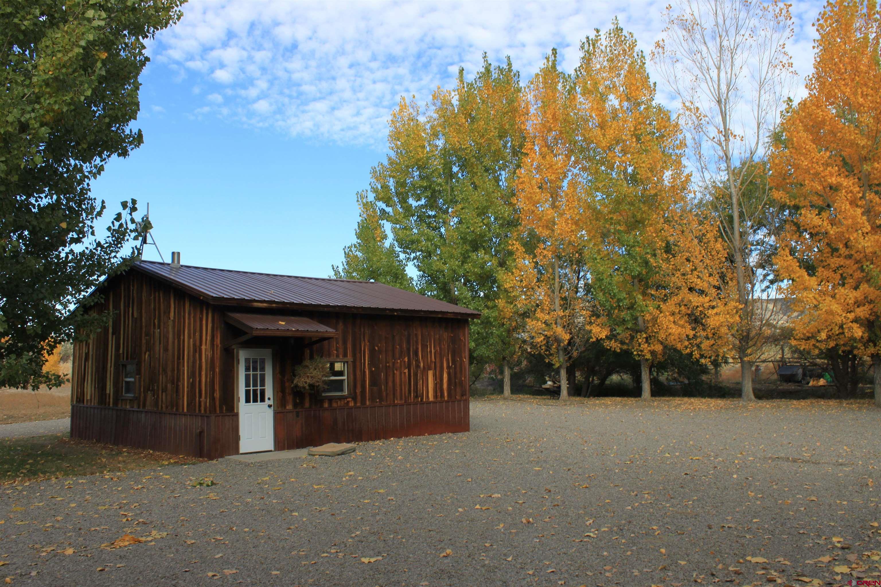 20976 6840th Road Montrose, CO 81403 - Photo 23 of 33 a view of a house with a yard