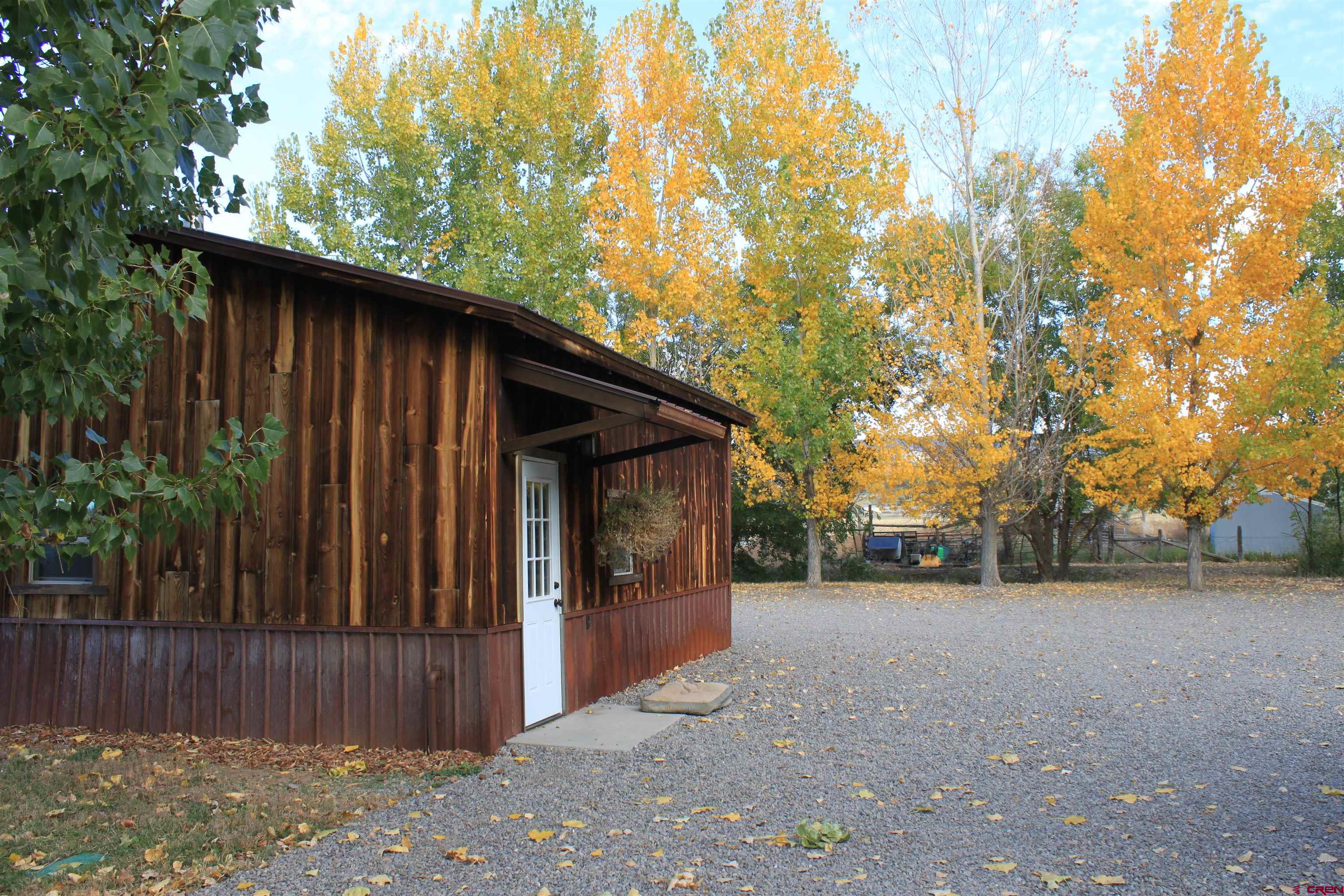 20976 6840th Road Montrose, CO 81403 - Photo 24 of 33 a view of a house with a outdoor space