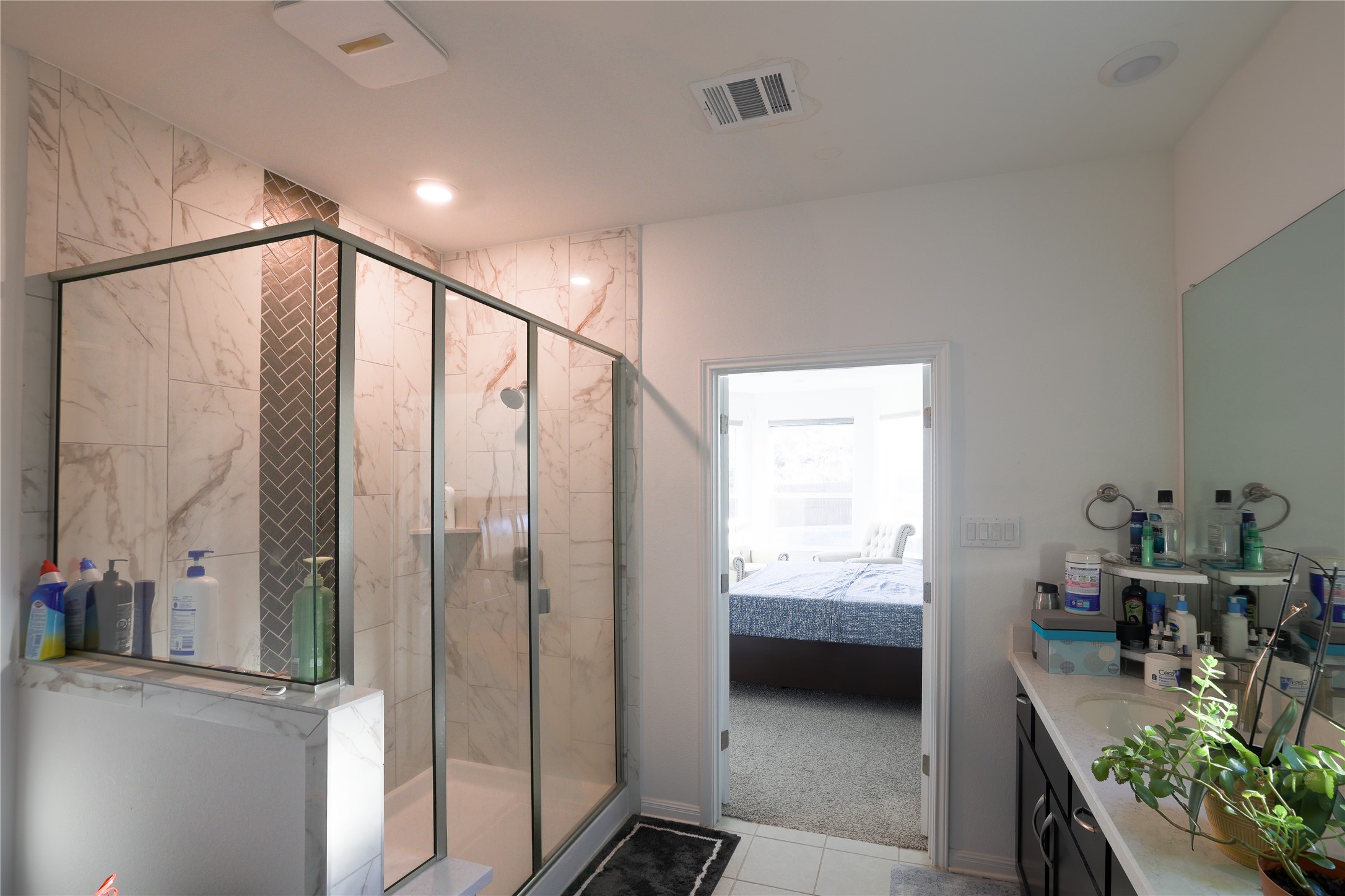 232 Barton Oak Trail Georgetown, TX 78628 - Photo 18 of 19 Ensuite bathroom with vanity and a marble finish shower