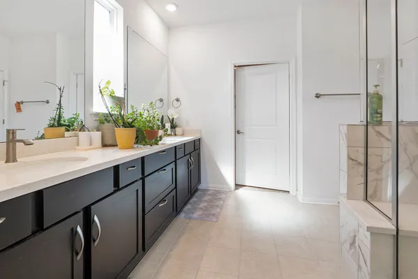 a kitchen with stainless steel appliances a sink stove and cabinets