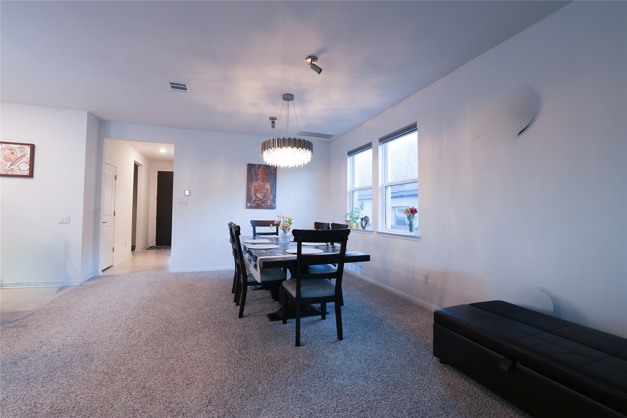 232 Barton Oak Trail Georgetown, TX 78628 - Photo 5 of 19 Dining room featuring light colored carpet and hanging lights