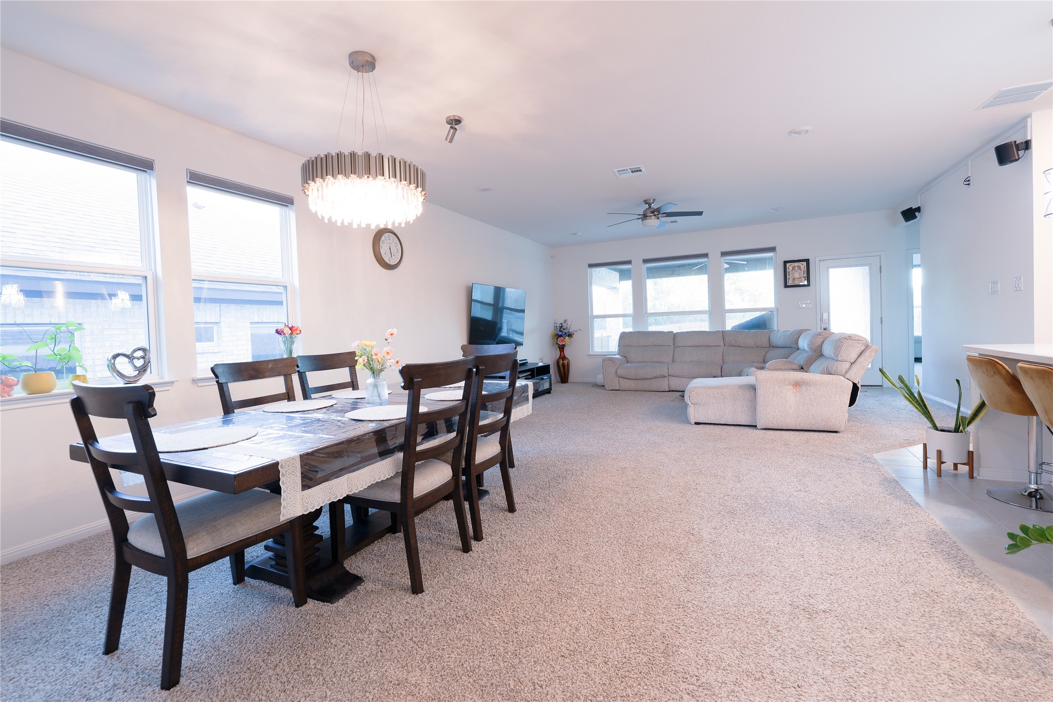 232 Barton Oak Trail Georgetown, TX 78628 - Photo 8 of 19 Dining space with ceiling fan, light colored carpet, and a chandelier