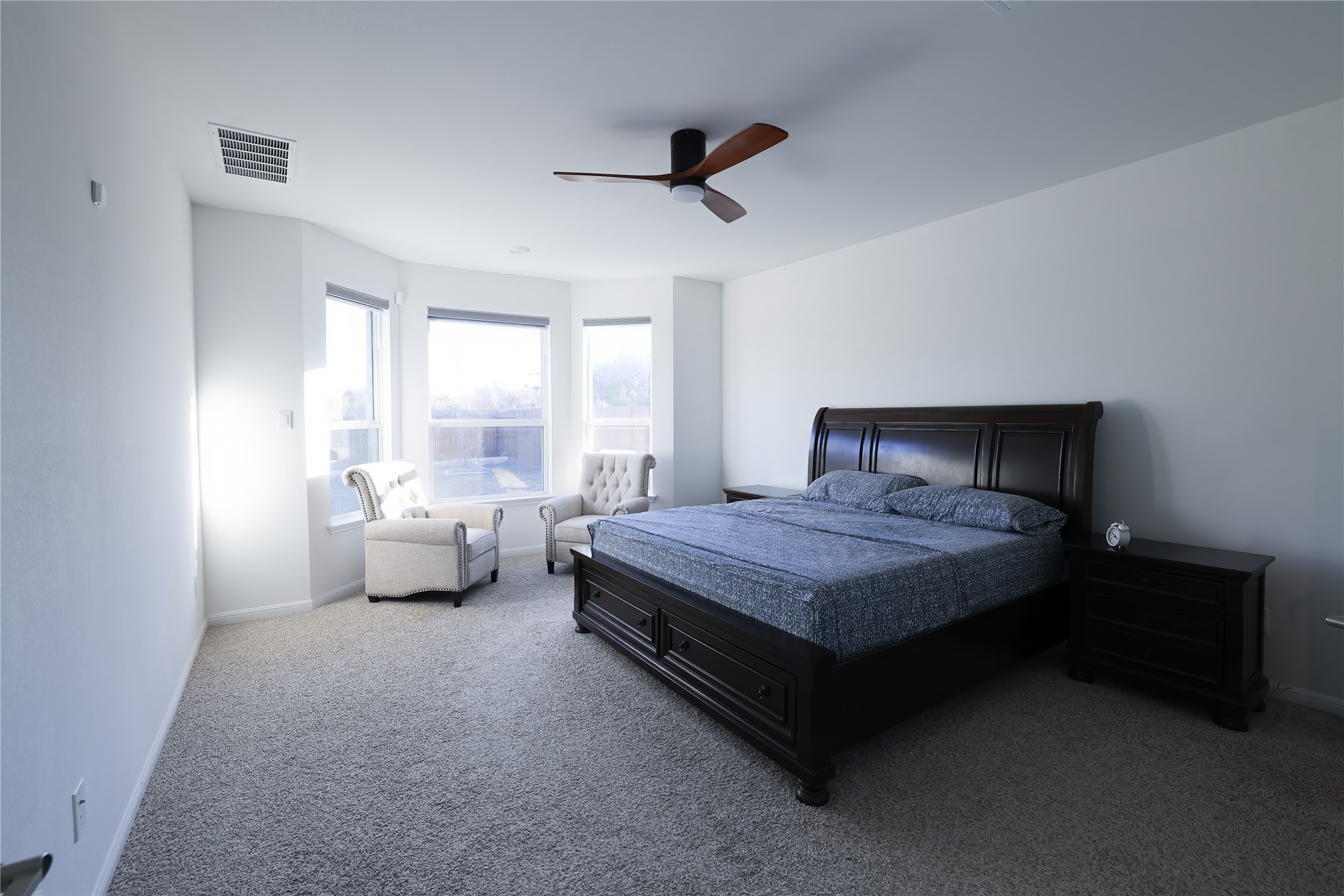 232 Barton Oak Trail Georgetown, TX 78628 - Photo 10 of 19 Bedroom featuring light carpet and a ceiling fan