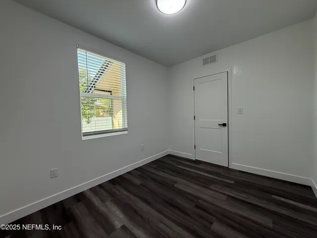 a room that has a stove and a window