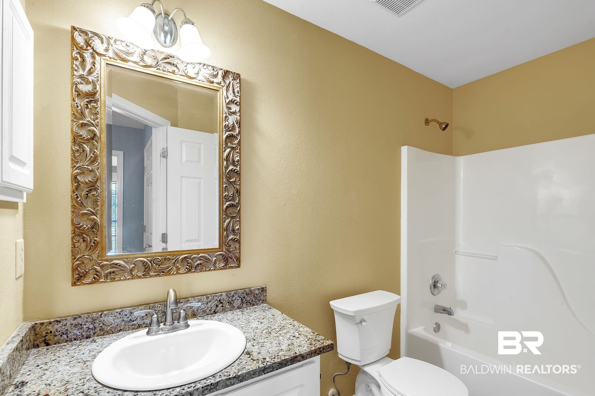 16444 Hamlet Lane Foley, AL 36535 - Photo 35 of 49 Bathroom with visible vents, toilet, vanity, and shower / tub combination