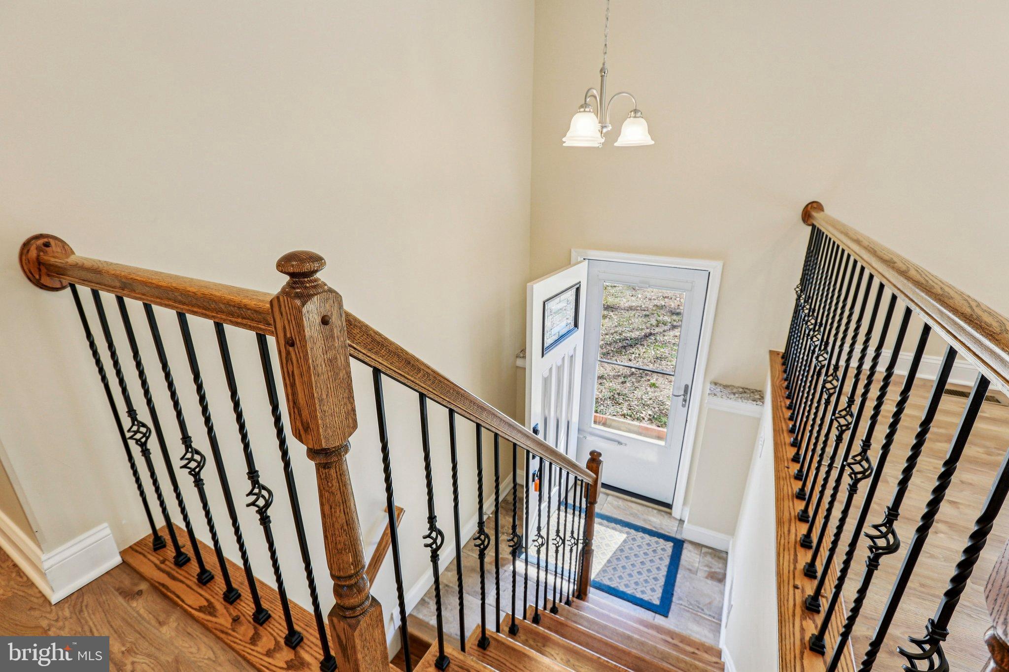 306 Christy Road Pasadena, MD 21122 - Photo 4 of 58 Inviting entryway with elegant staircase.