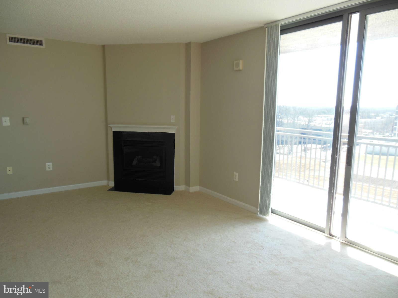 11710 Old Georgetown Road, Unit 1001 Rockville, MD 20852 - Photo 7 of 21 Living Room with gas fireplace
