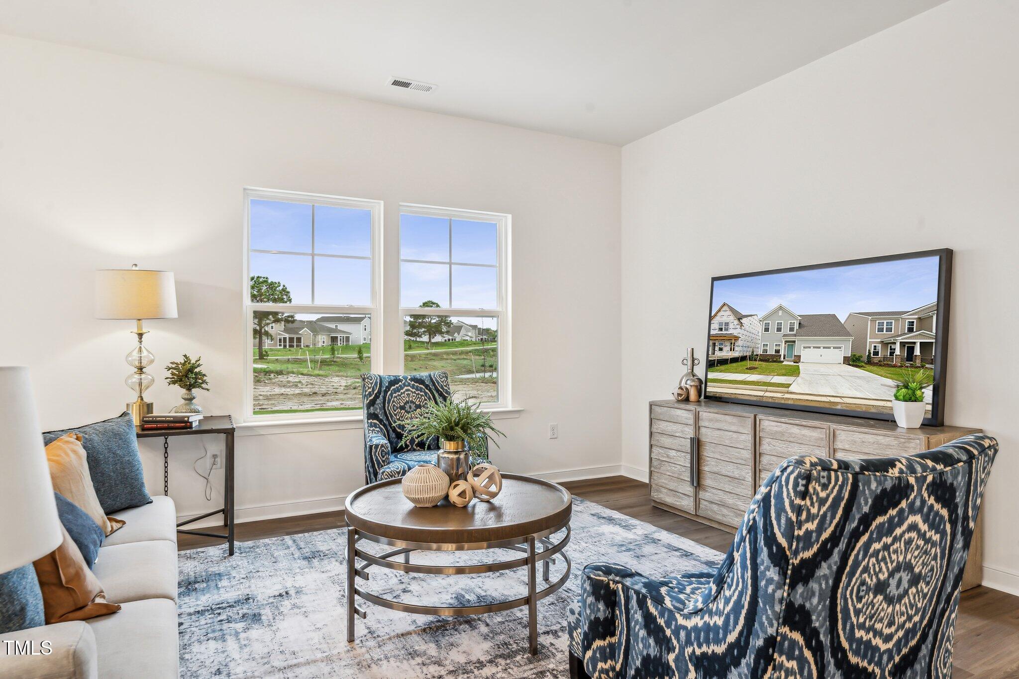 149 Cribbs Lane Middlesex, NC 27557 - Photo 11 of 33 a living room with furniture and a potted plant